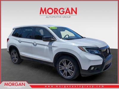 2021 Honda Passport EX-L in Platinum White Pearl — front three-quarter view