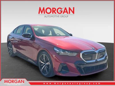 2025 BMW i5 M60 in Red — front three-quarter view