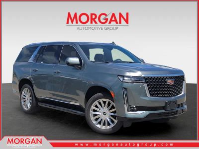 2023 Cadillac Escalade 4WD Premium Luxury in Dark Emerald Metallic — front three-quarter view