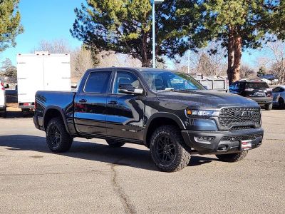 2026 RAM 1500 RAM 1500 REBEL CREW CAB 4X4 5'7' BOX in Forged Blue Metallic Exterior Paint — front three-quarter view