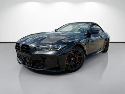 2023 BMW M4 Competition xDrive in Black Sapphire Metallic — front three-quarter view