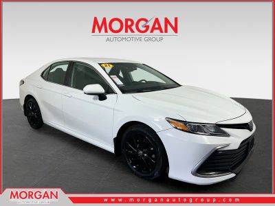 2021 Toyota Camry LE in Super White — front three-quarter view