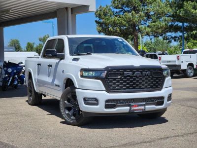 2026 RAM 1500 RAM 1500 BIG HORN CREW CAB 4X4 5'7' BOX in Bright White Clear-Coat Exterior Paint — front three-quarter view