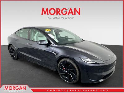 2024 Tesla Model 3 Performance in Stealth Gray — front three-quarter view