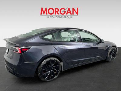 2024 Tesla Model 3 — rear three-quarter view