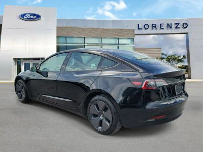 2023 Tesla Model 3 — rear three-quarter view