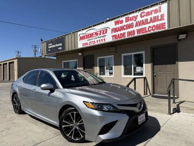 2019 Toyota Camry in Silver — front three-quarter view