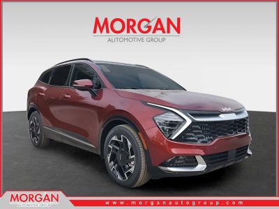2025 Kia Sportage SX-Prestige in Dawning Red — front three-quarter view