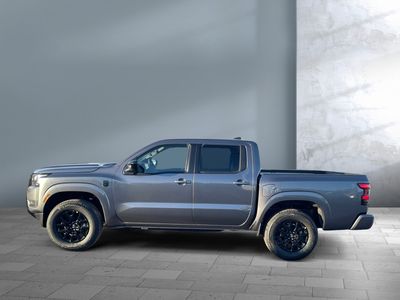 2026 Nissan Frontier — rear three-quarter view