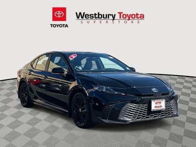 2026 Toyota Camry SE in Midnight Black Metallic — front three-quarter view