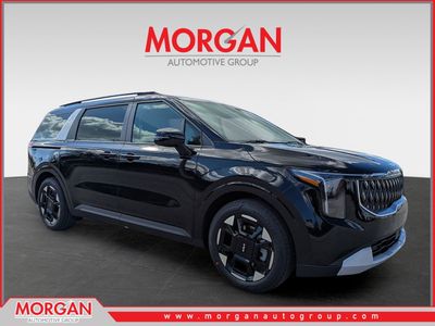 2026 Kia Carnival EX in Aurora Black Pearl — front three-quarter view