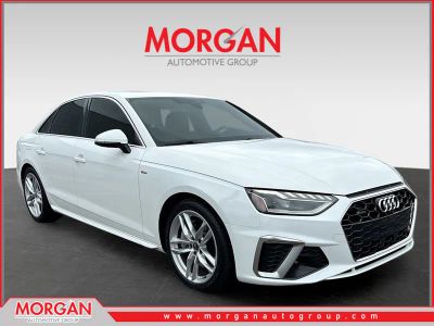 2023 Audi A4 Sedan S line Premium Plus in Ibis White — front three-quarter view