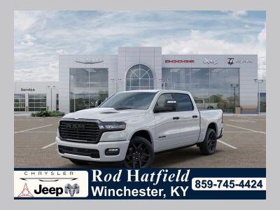 2026 RAM Ram 1500 RAM 1500 LARAMIE CREW CAB 4X4 5'7' BOX in Bright White Clear-Coat Exterior Paint — front three-quarter view