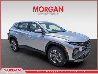 2026 Hyundai TUCSON HYBRID Blue SE in Shimmering Silver — front three-quarter view