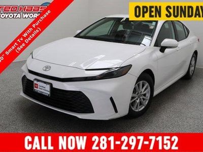 2025 Toyota Camry LE 2.5L/Electric in Ice Cap — front three-quarter view