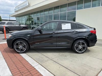 2016 BMW X4 — rear three-quarter view