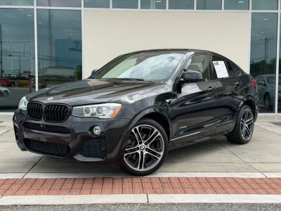 2016 BMW X4 xDrive28i in Black — front three-quarter view