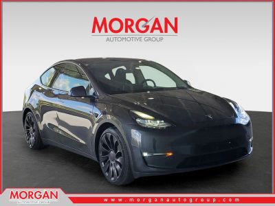 2024 Tesla Model Y Performance in Gray — front three-quarter view