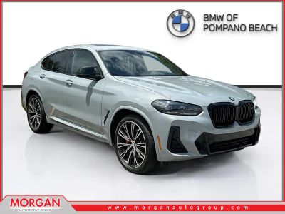 2024 BMW X4 M40i in Brooklyn Grey Metallic — front three-quarter view