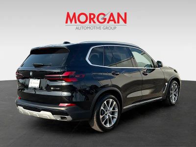 2026 BMW X5 — rear three-quarter view