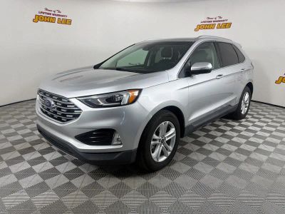 2019 Ford Edge SEL in Ingot Silver Metallic — front three-quarter view