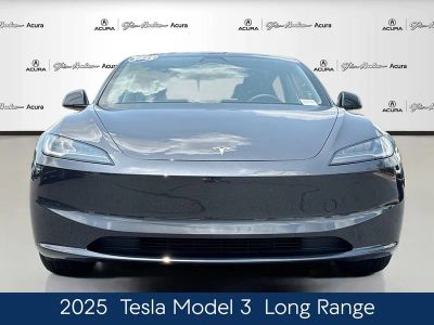 2025 Tesla Model 3 — rear three-quarter view