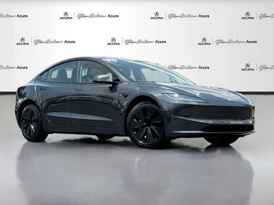 2025 Tesla Model 3 Long Range in Stealth Grey — front three-quarter view