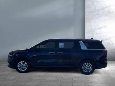 2024 Kia Carnival — rear three-quarter view
