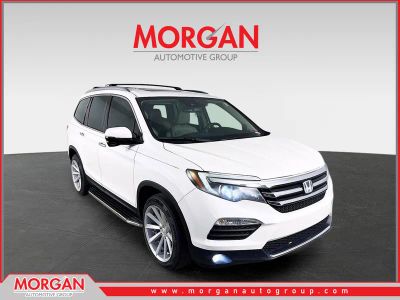 2016 Honda Pilot Touring in White — front three-quarter view