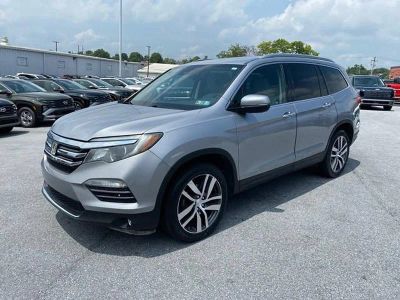 2017 Honda Pilot Elite in Lunar Silver Metallic — front three-quarter view