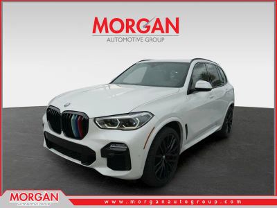 2021 BMW X5 sDrive40i in Mineral White Metallic — front three-quarter view