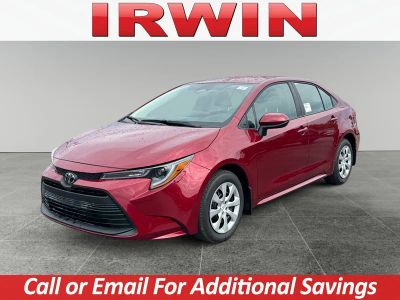 2026 Toyota Corolla LE in Ruby Flare Pearl — front three-quarter view