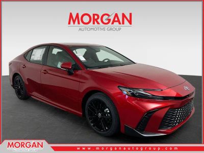 2026 Toyota Camry SE in Supersonic Red — front three-quarter view