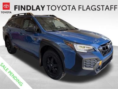 2024 Subaru Outback Wilderness in Geyser Blue — front three-quarter view