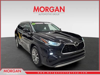 2021 Toyota Highlander Platinum in Midnight Black Metallic — front three-quarter view