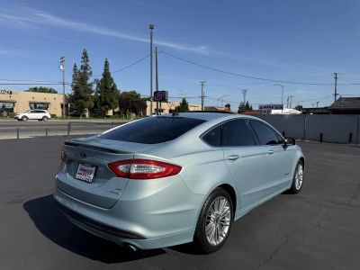 2014 Ford Fusion — rear three-quarter view