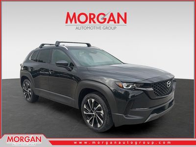 2026 Mazda CX-50 Hybrid Premium Plus in Jet Black Mica — front three-quarter view