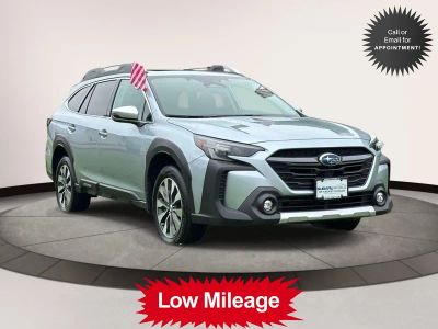 2025 Subaru Outback Touring AWD in Silver — front three-quarter view
