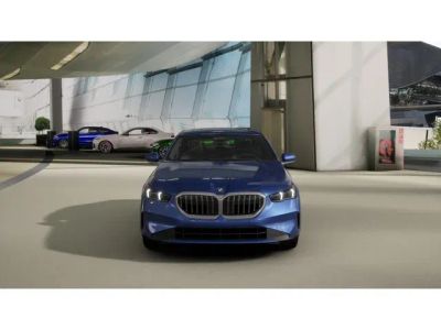 2027 BMW 5 Series — rear three-quarter view