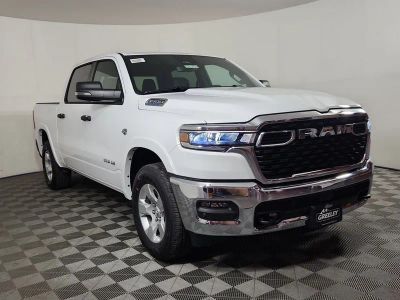 2026 RAM 1500 RAM 1500 BIG HORN CREW CAB 4X4 5'7' BOX in Bright White Clear-Coat Exterior Paint — front three-quarter view