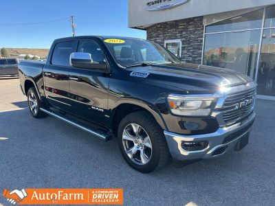 2021 RAM 1500 Laramie in Diamond Black Crystal Pearlcoat — front three-quarter view