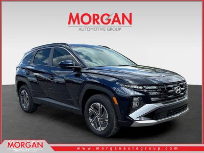 2025 Hyundai Tucson Hybrid Blue in Deep Sea — front three-quarter view