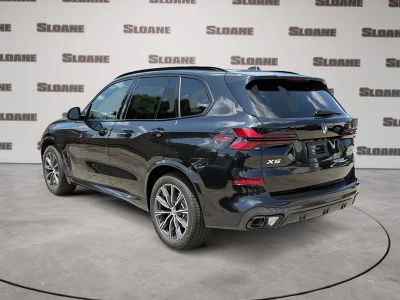2026 BMW X5 — rear three-quarter view