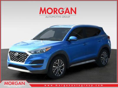 2021 Hyundai Tucson SEL in Aqua Blue — front three-quarter view
