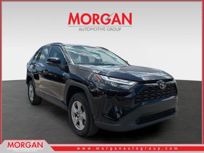 2024 Toyota RAV4 XLE in Midnight Black Metallic — front three-quarter view