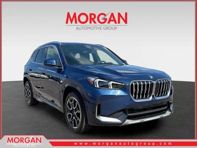2025 BMW X1 xDrive28i in Phytonic Blue Metallic — front three-quarter view