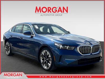 2025 BMW 5 Series 530i in Blue Metallic — front three-quarter view