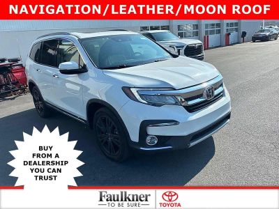 2021 Honda Pilot Touring 7-Passenger AWD in Platinum White Pearl — front three-quarter view