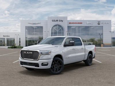 2026 RAM Ram 1500 RAM 1500 LARAMIE CREW CAB 4X4 5'7' BOX in Bright White Clear-Coat Exterior Paint — front three-quarter view