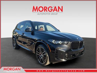 2026 BMW X5 xDrive40i in Black Sapphire Metallic — front three-quarter view